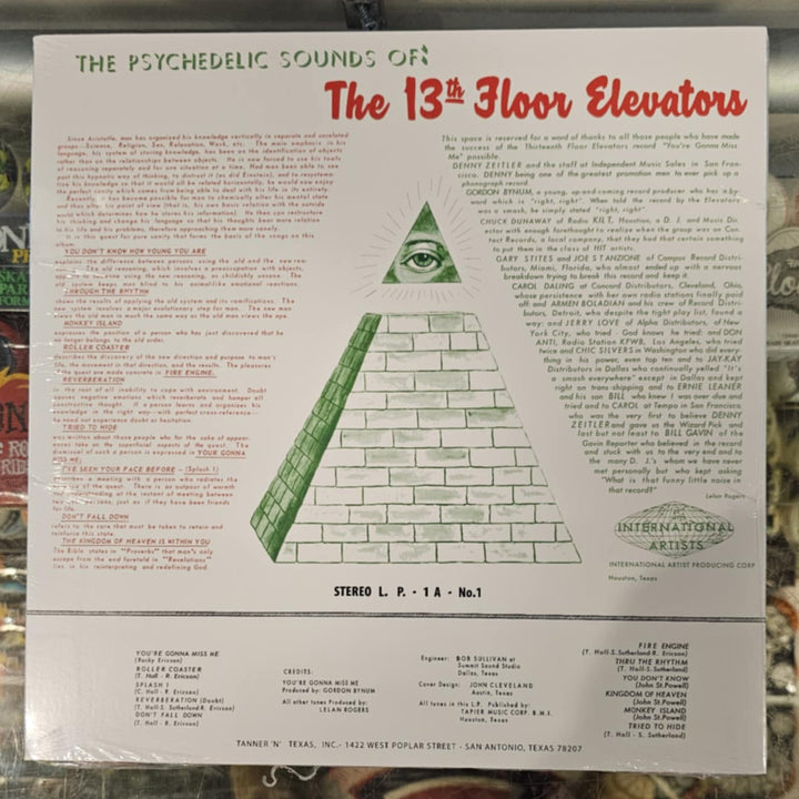 back of a vinyl record lp cover with text and a triangle design on a colorful background
