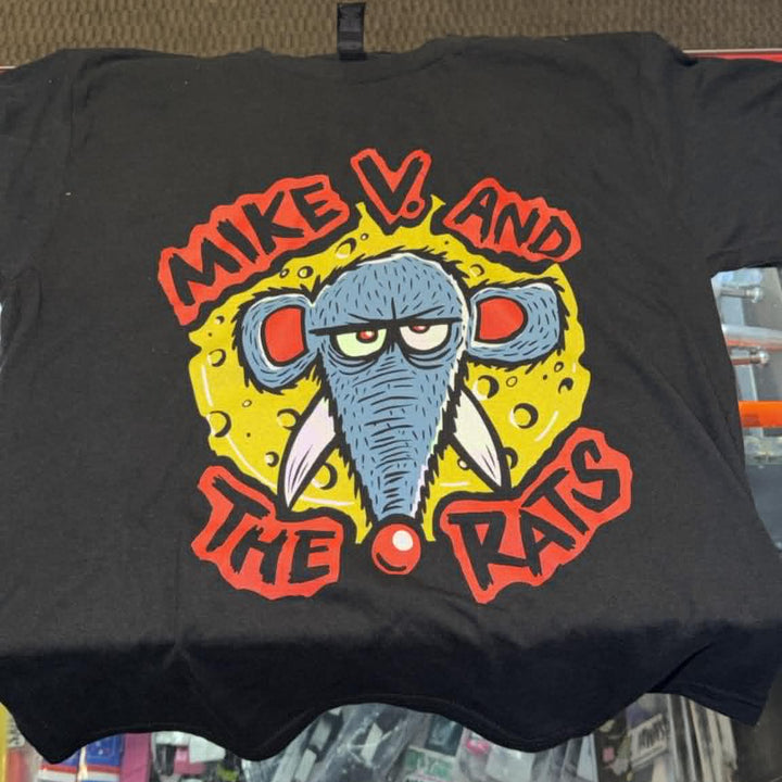 A black graphic t-shirt featuring a cartoon gray elephant with red eyes and the text 'MIKE V. AND THE RATS' in red, displayed on a shelf.
