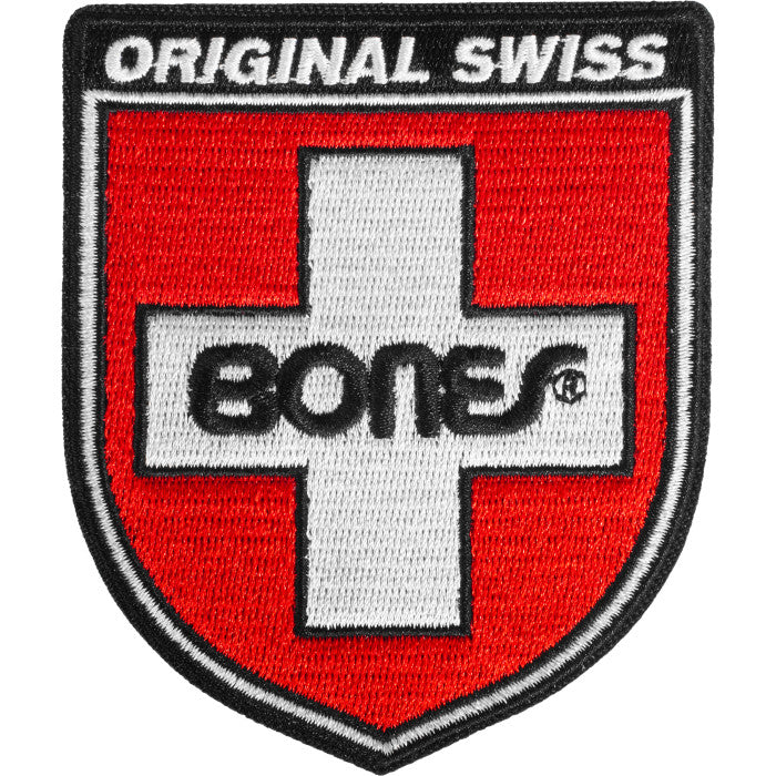 Patch with 'Original Swiss Bones' text and logo on a red background