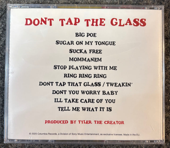 TYLER, THE CREATOR - DON'T TAP THE GLASS  case with tracklist and production credit on a textured surface