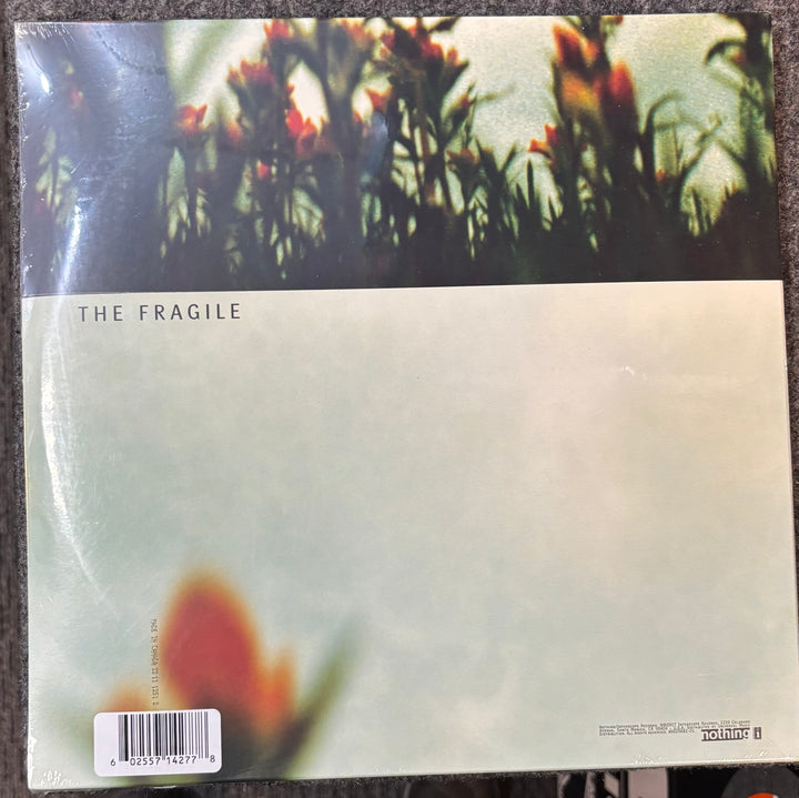 Nine Inch Nails – The Fragile  record cover with 'The Fragile' text and floral design