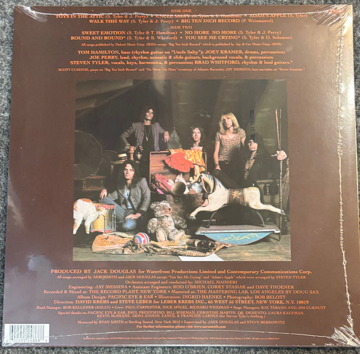 Back cover of a AEROSMITH – TOYS IN THE ATTIC with band members and text