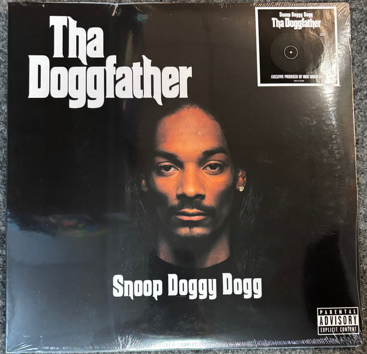 Vinyl record cover of 'The Doggfather' by Snoop Dogg with a dark background and prominent text.
