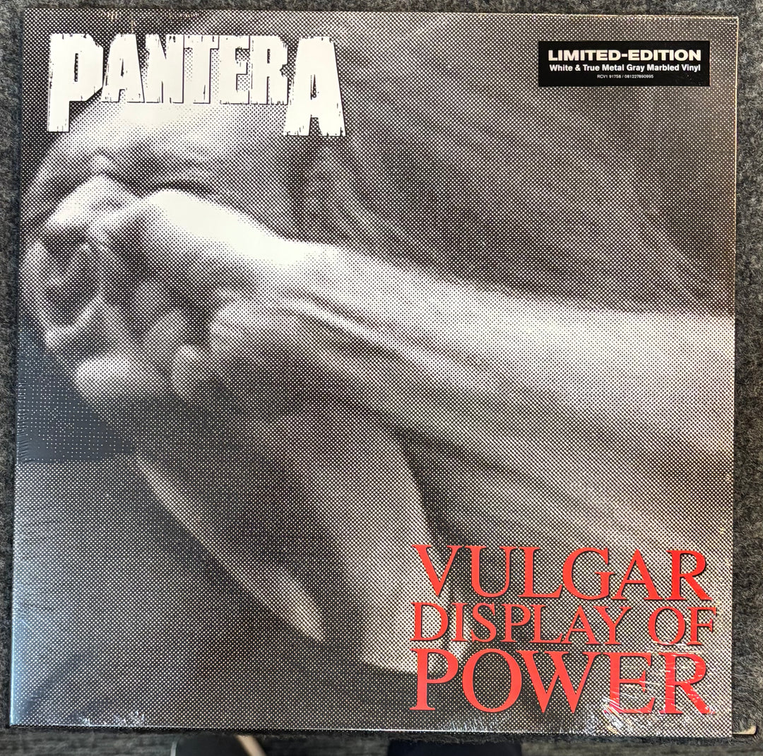 Vinyl album cover of Pantera's 'Vulgar Display of Power' with a black and white image of a hand holding a gun.