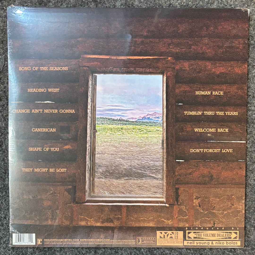 Neil Young Barn record cover with window design and text on a textured surface