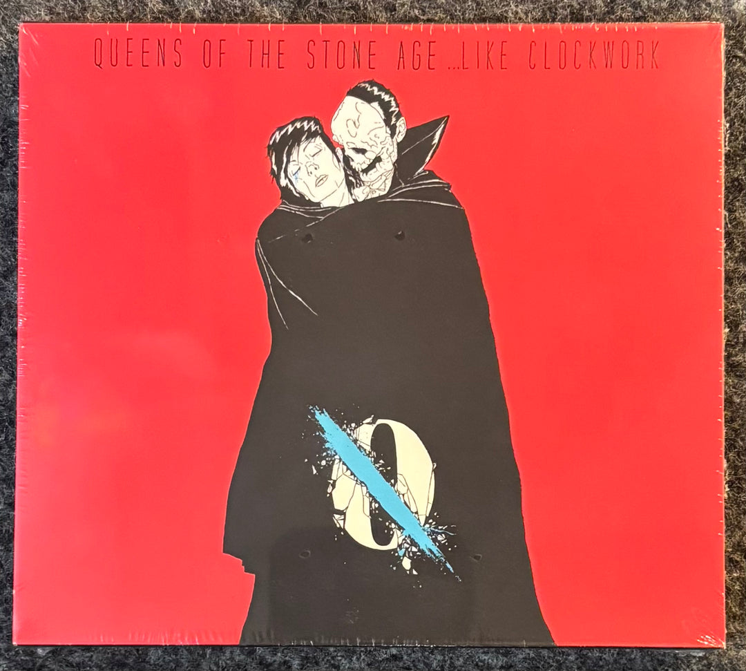 QUEENS OF THE STONE AGE - ...LIKE CLOCKWORK CD cover with illustration of two figures and 'Queens of the Stone Age Like Clockwork' text on red background