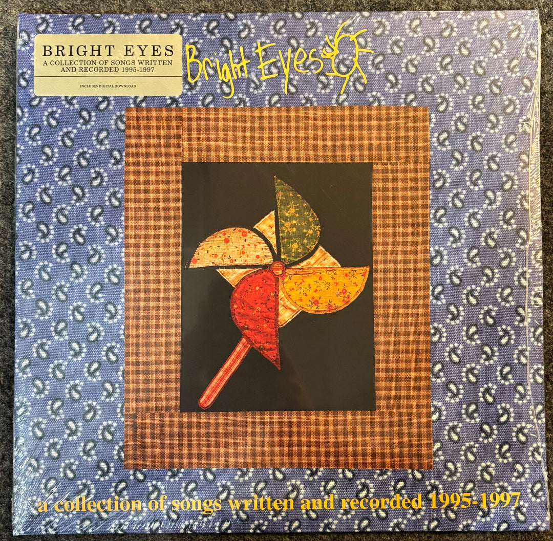 Bright Eyes ‎– A Collection Of Songs Written & Recorded 1995-1997 record cover with a colorful pinwheel design and text about songs written and recorded by Bright Eyes.