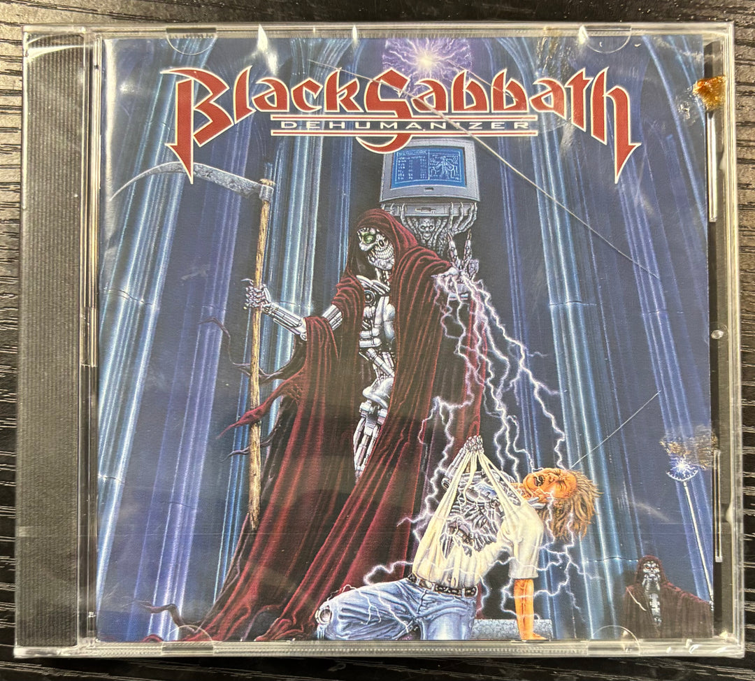 CD cover of Black Sabbath album 'Dehumanizer' with a dramatic illustration.