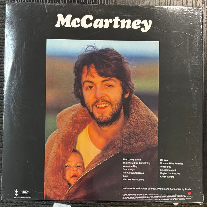 MCCARTNEY, PAUL – McCartney record cover featuring a man holding a baby with 'McCartney' at the top.