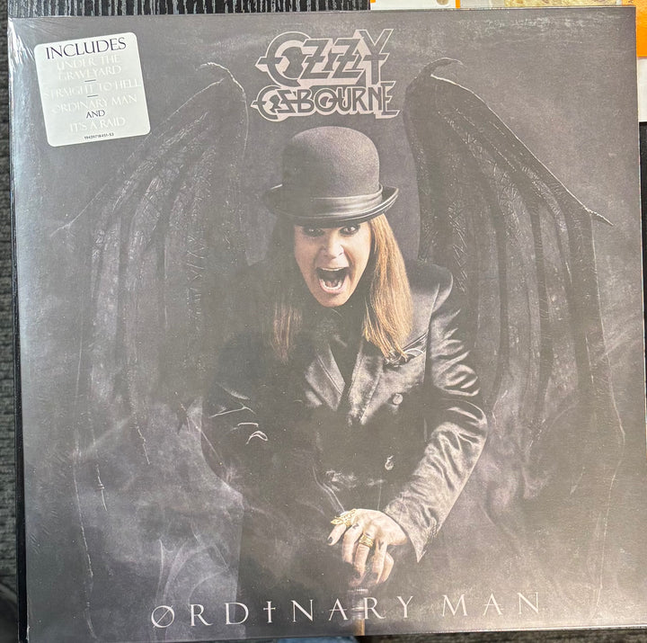 Ozzy Osbourne - Ordinary Man cover featuring a person with wings and the text 'Ozzy Osbourne Ordinary Man'.