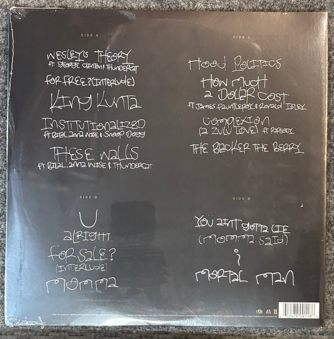 Kendrick Lamar – To Pimp A Butterfly record sleeve with track listing on a reflective surface