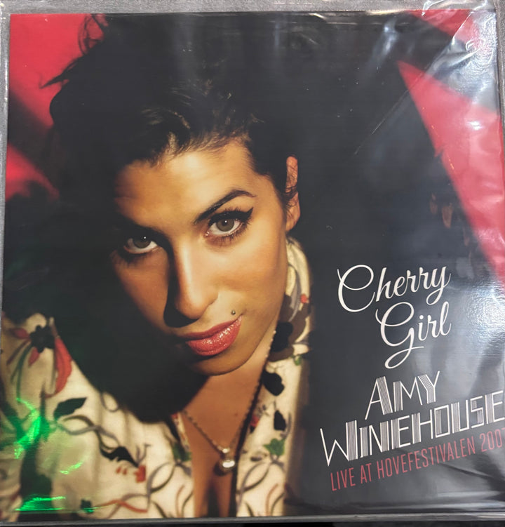 Album cover of 'Cherry Girl' by Amy Winehouse with a close-up of the artist's face.