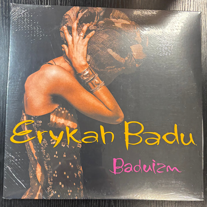 Vinyl record cover of Erykah Badu's 'Baduizm' with a person wearing a headscarf.