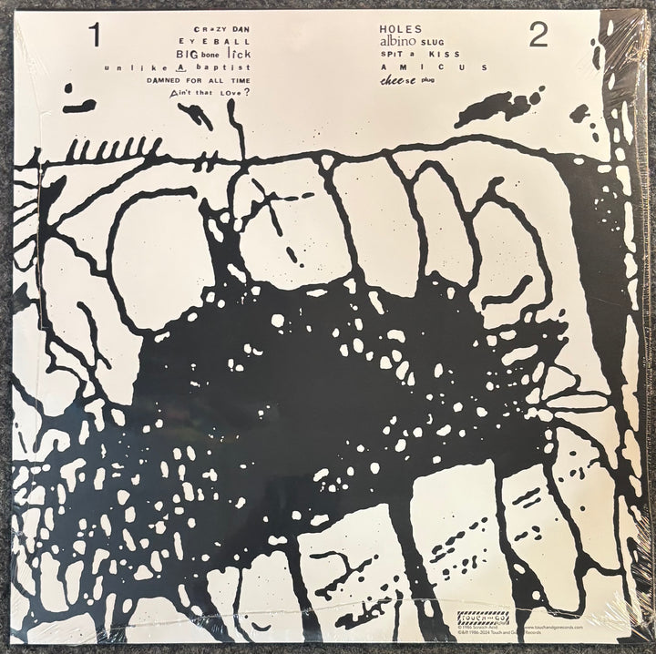 The album cover of Scratch Acid ‎– Just Keep Eating, featuring a high-contrast black and off-white abstract graphic design with tracklist text at the top.