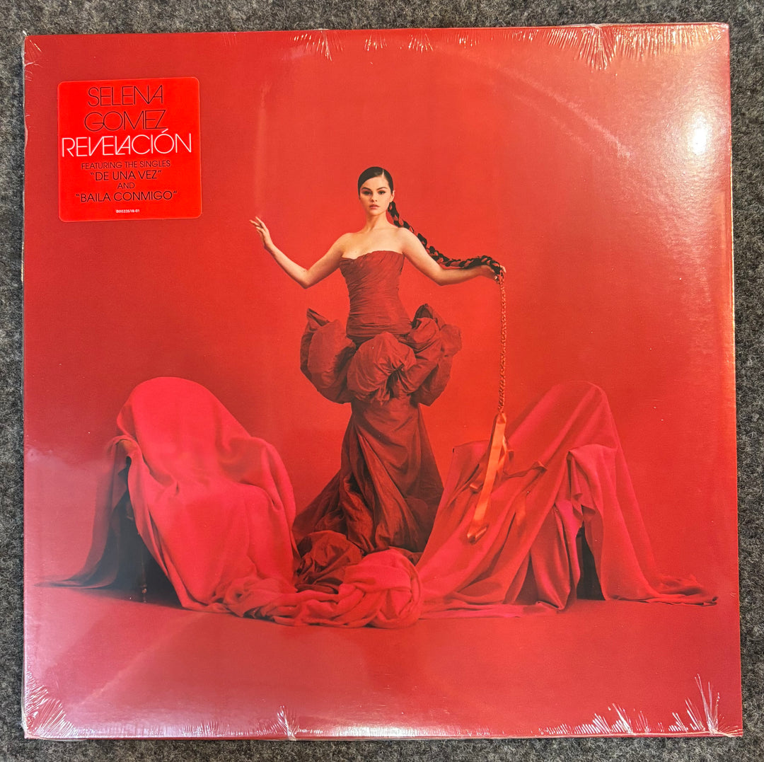 GOMEZ, SELENA - REVELACION Vinyl record cover with a woman in a red dress on a red background