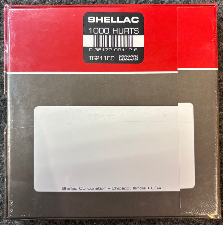 Packaged product with Shellac label on a red background