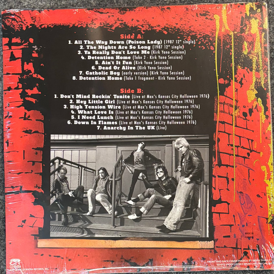 Dead Boys - Ignorance In Action record sleeve with tracklist and black and white photo of band members on a red background