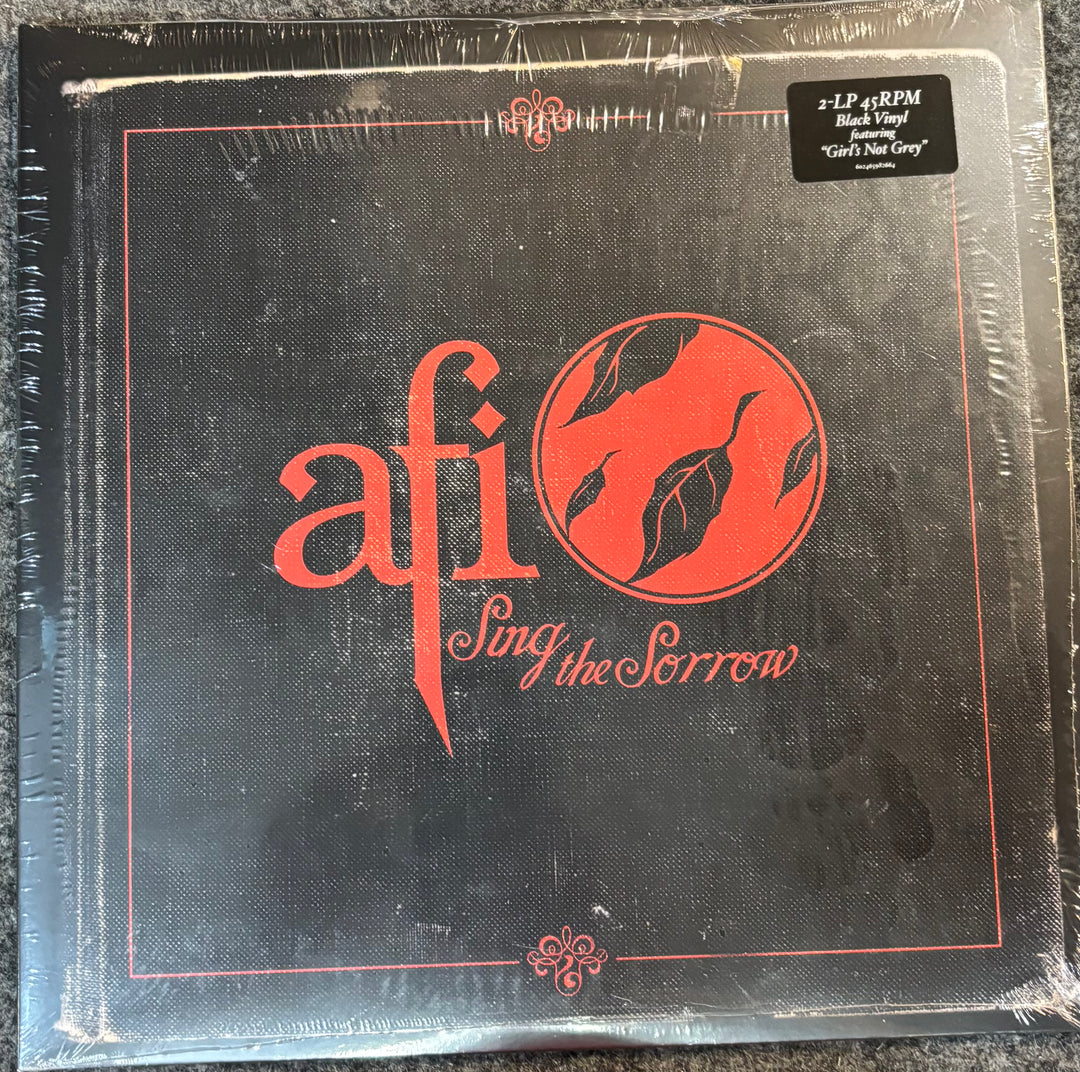 Vinyl record cover with 'afi' and 'Sing the Sorrow' text on a black background