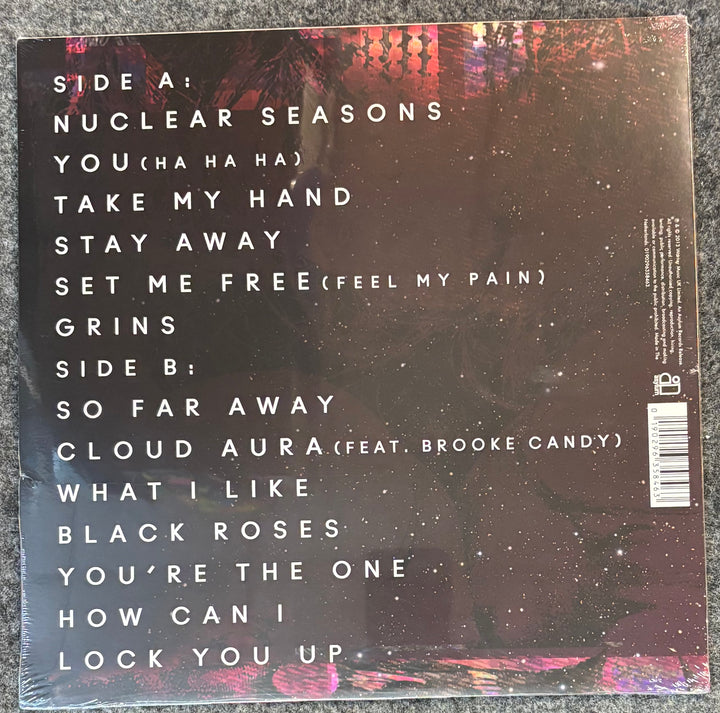 Back cover of CHARLI XCX - TRUE ROMANCE with track listing on a textured surface