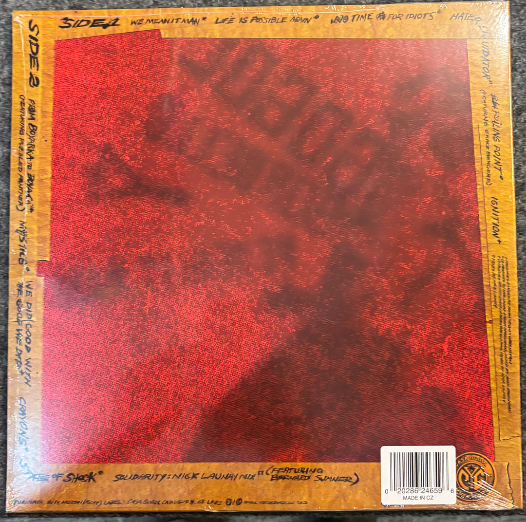 GOGOL BORDELLO – WE MEAN IT, MAN! record cover with red center and yellow text on the edges
