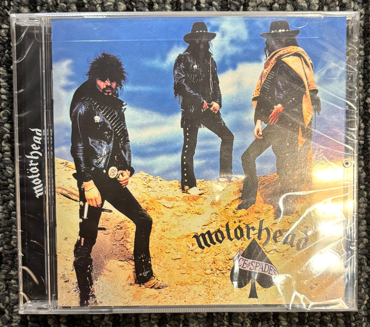 CD cover of Motorhead Ace of Spades with band members on a desert background