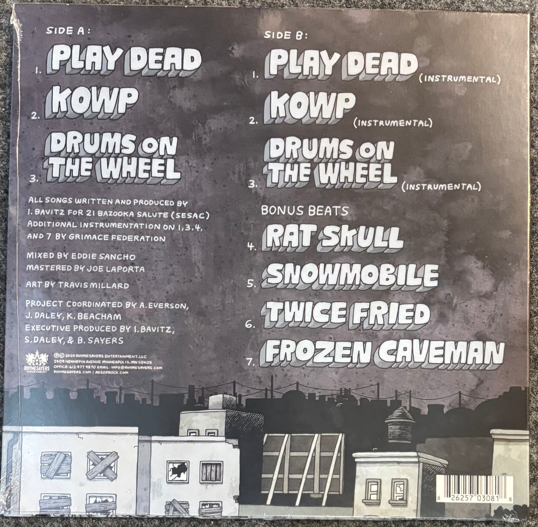 The back cover of Aesop Rock - Freedom Finger (Music from the Game, showing Side A and Side B track listings on a dark textured background with a city skyline and rooftops at the bottom.
