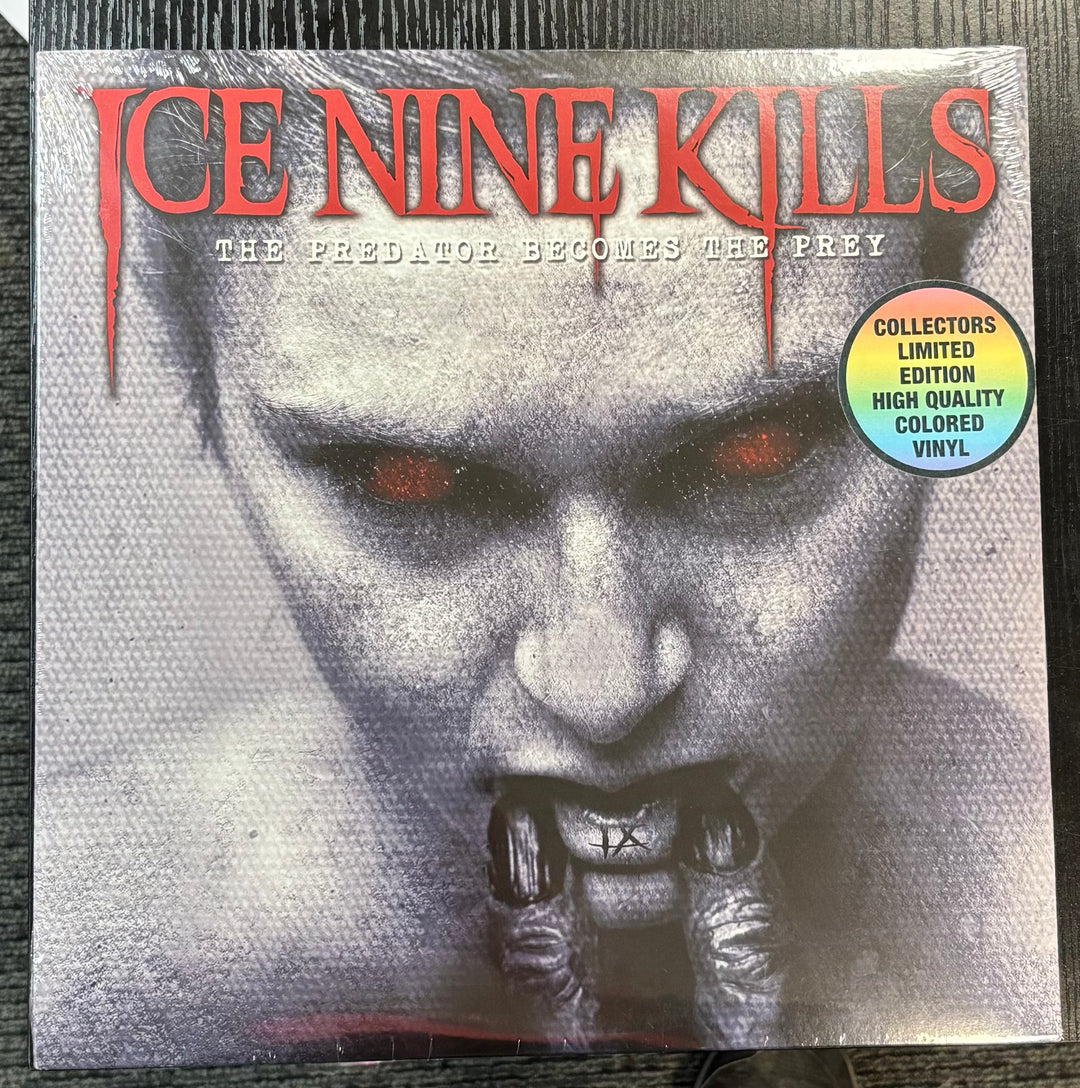 Album cover for ICE NINE KILLS – The Predator Becomes The Prey with a stylized face and text.