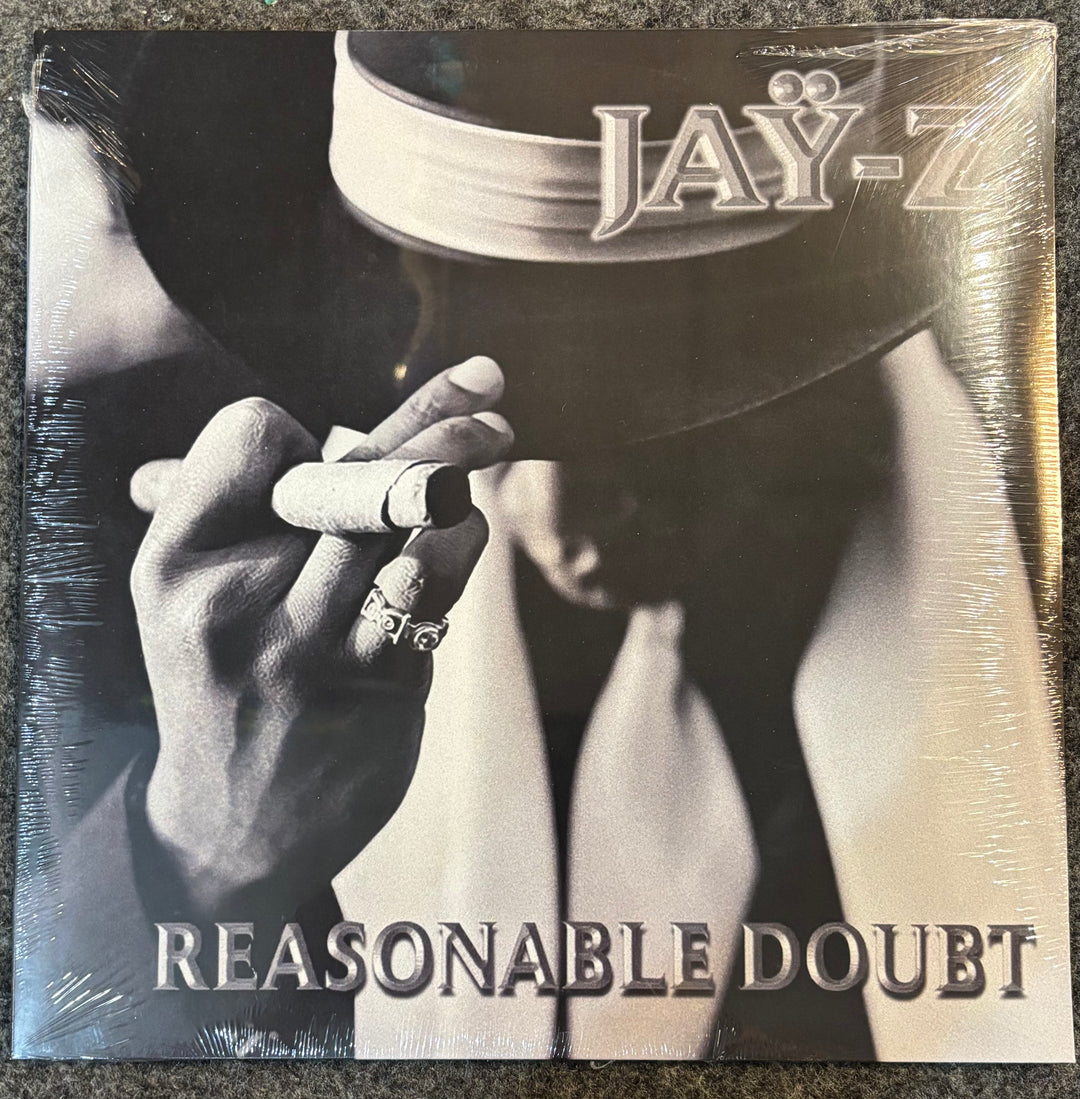 Album cover of 'Reasonable Doubt' by Jay-Z with a close-up of a hand holding a cigarette.