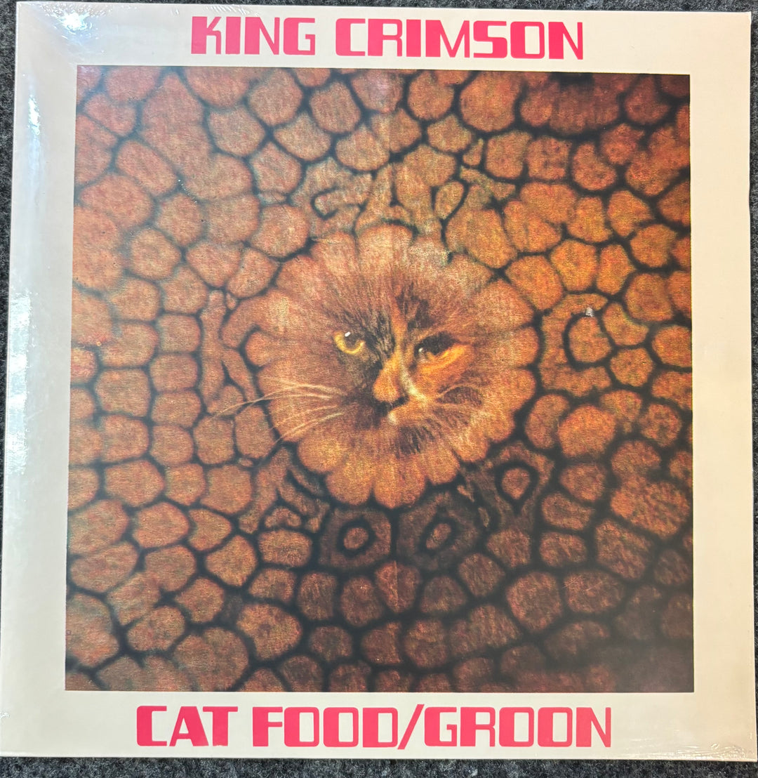 Album cover for King Crimson's 'Cat Food/Groon' with a cat on a textured background.