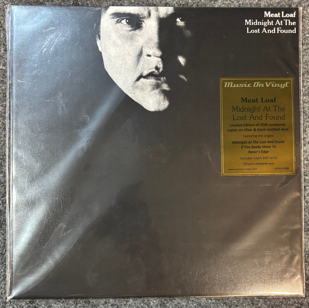 Meat Loaf – Midnight At The Lost And Found vinyl record cover with a black and white portrait and gold label on a textured surface
