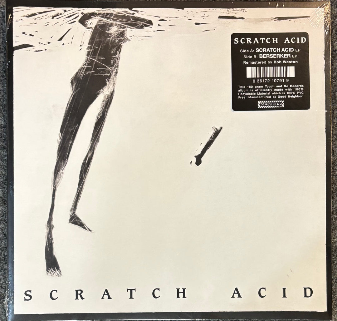 Scratch Acid record cover with a black and white illustration of a leg and text 'Scratch Acid'.