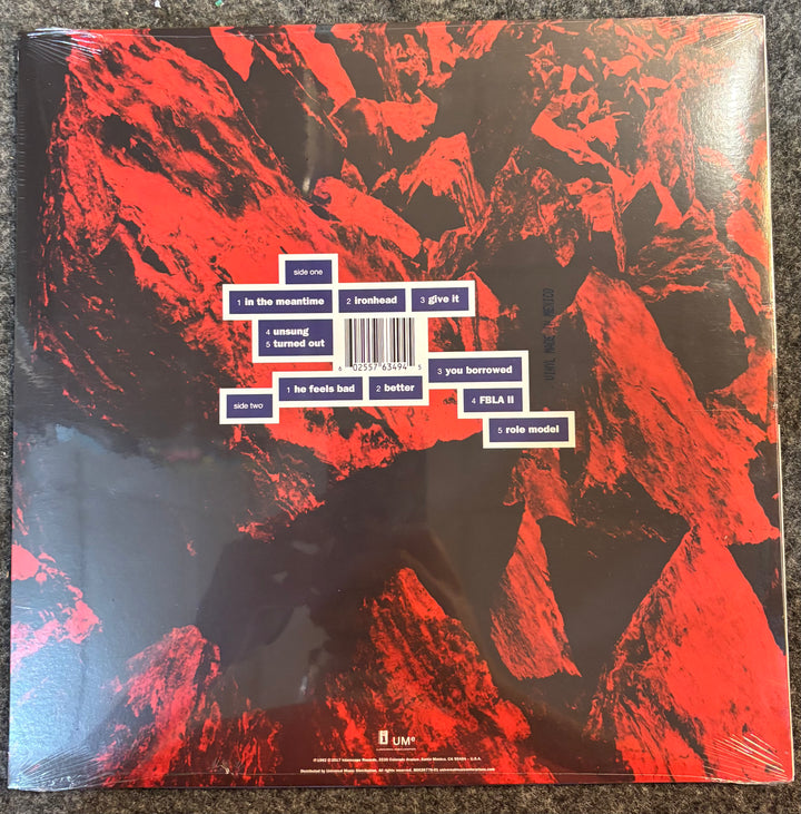 HELMET - MEANTIME (BLUE/RED VINYL record cover with red and black abstract design and text