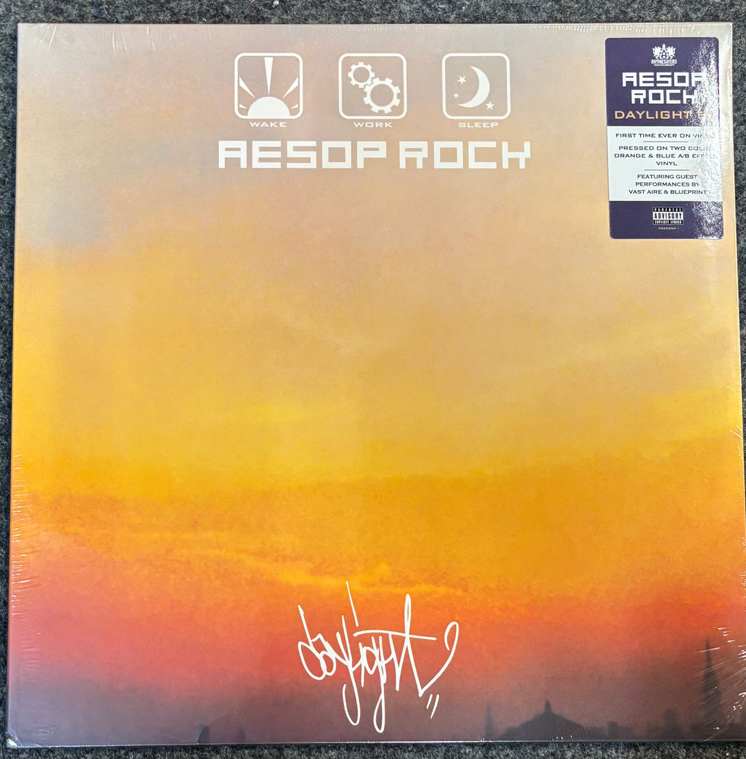 A vinyl record album for 'Daylight' by Resop Rock, featuring a sunset gradient cover with yellow, orange, and red tones, sealed in plastic with a sticker on the top right.