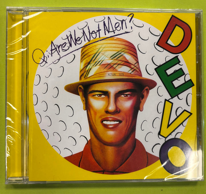CD cover of Devo's 'Are We Not Men?' with a person wearing a hat on a yellow background