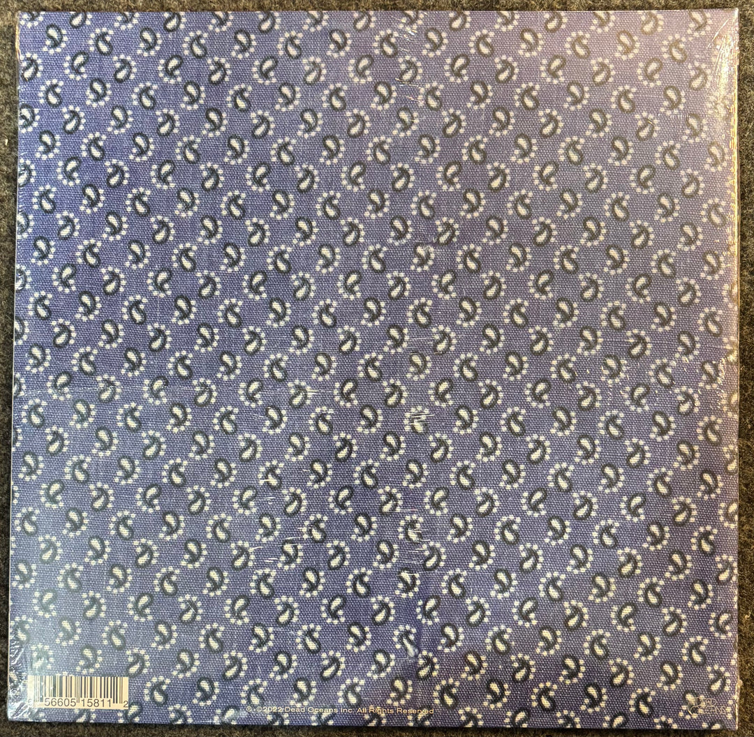 Bright Eyes ‎– A Collection Of Songs Written & Recorded 1995-1997 cover with Patterned fabric swatch with small design on a blue background