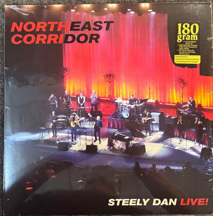 Vinyl record cover for 'North East Corridor' by Steely Dan with a live concert scene.