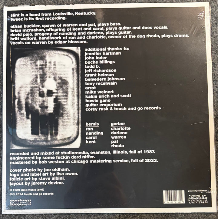 The back cover of Slint - Tweez, showing tracklist text, a black-and-white band photo, credits, and a barcode on a dark background.