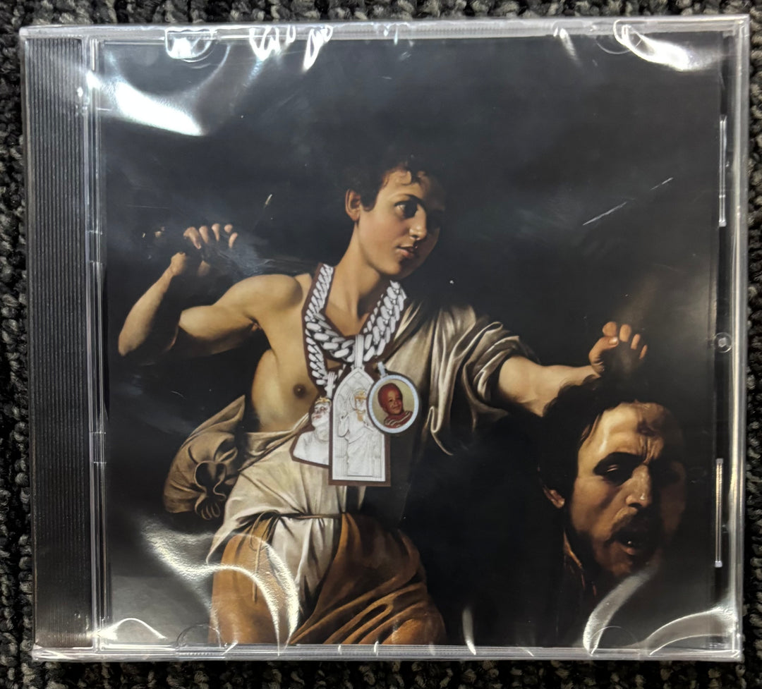 Westside Gunn Pray for Paris CD cover with classical painting of a man holding a head, on a textured surface.