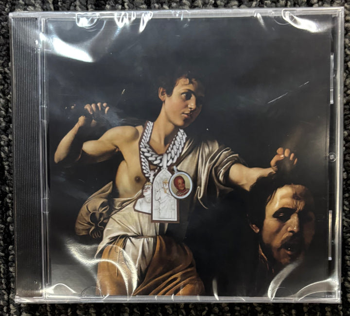 Westside Gunn Pray for Paris CD cover with classical painting of a man holding a head, on a textured surface.