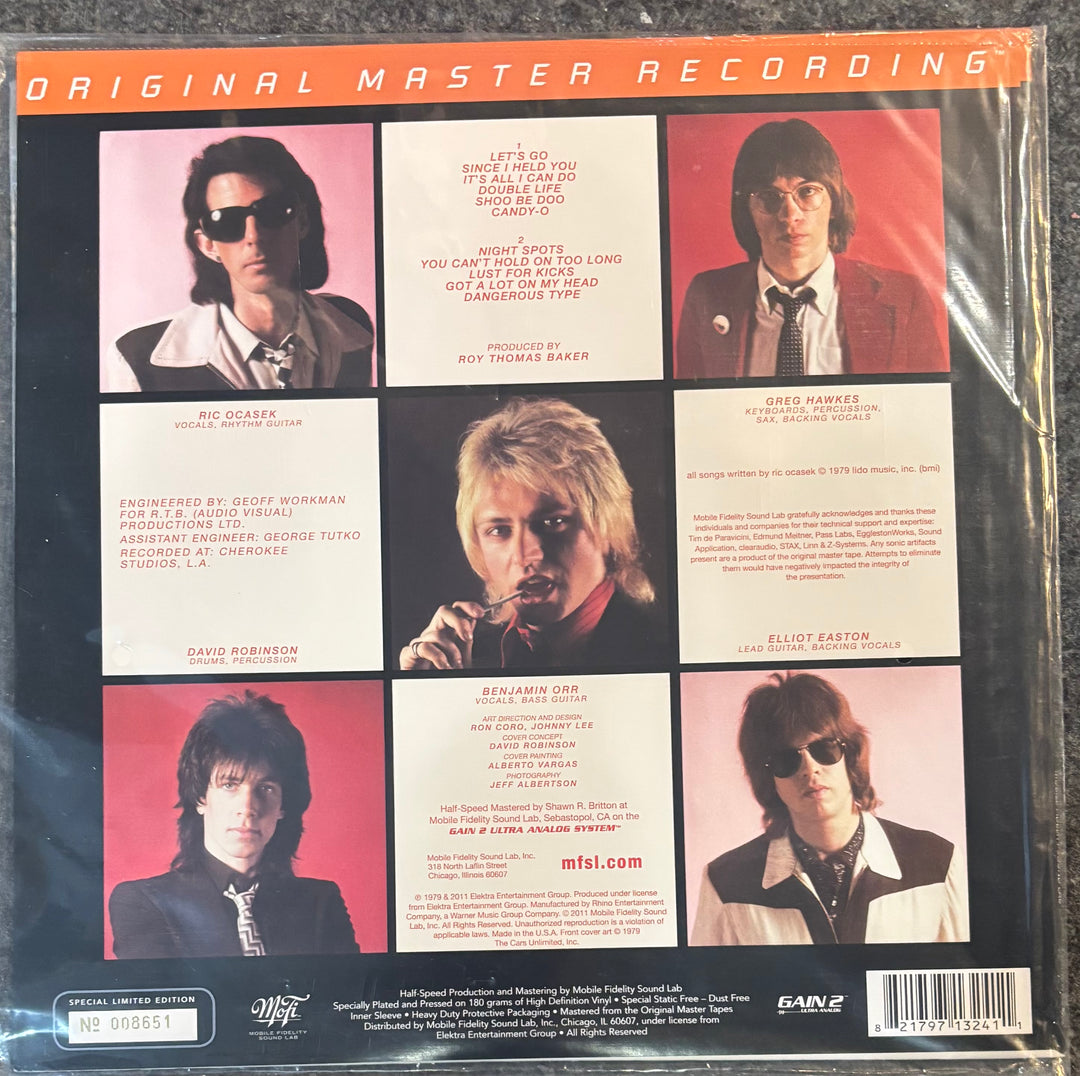 The back cover of a vinyl record sleeve for Cars, The - Candy-o. The cover features a 3x2 grid of six color photographs of the band members with song lyrics printed in white text boxes, set against a dark background with orange 'ORIGINAL MASTER RECORDING' lettering at the top.