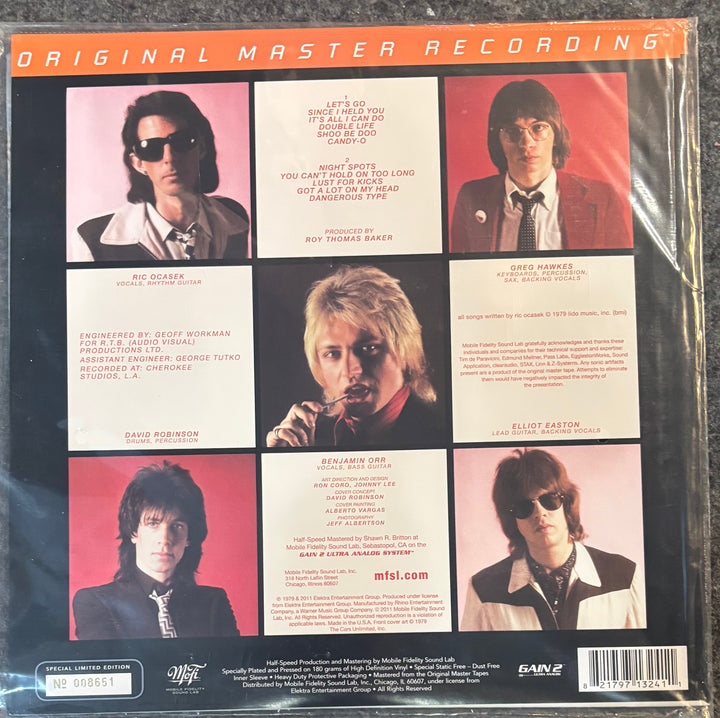 The back cover of a vinyl record sleeve for Cars, The - Candy-o. The cover features a 3x2 grid of six color photographs of the band members with song lyrics printed in white text boxes, set against a dark background with orange 'ORIGINAL MASTER RECORDING' lettering at the top.