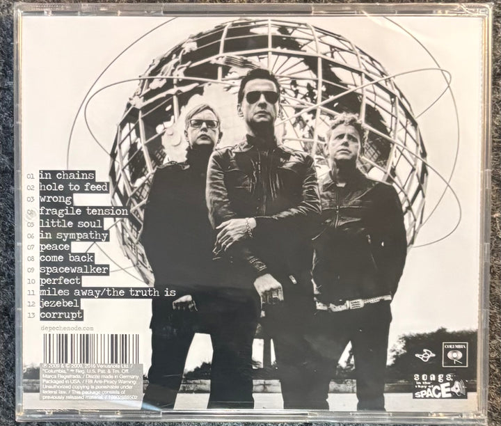 DEPECHE MODE – SOUNDS OF THE UNIVERSE cover with three people in front of a geometric design, featuring text and a barcode.