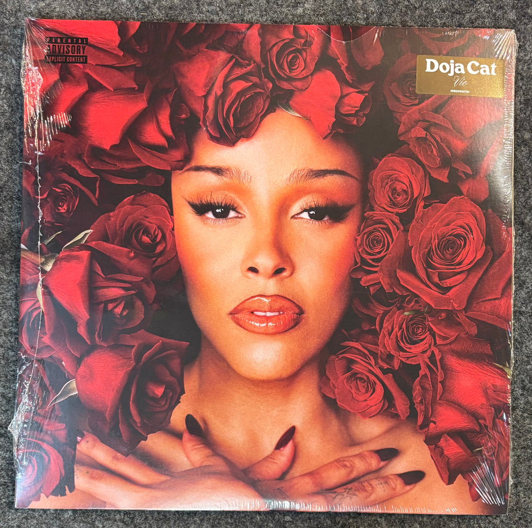 DOJA CAT - VIE Vinyl record cover with a person surrounded by red roses and 'Doja Cat' branding.