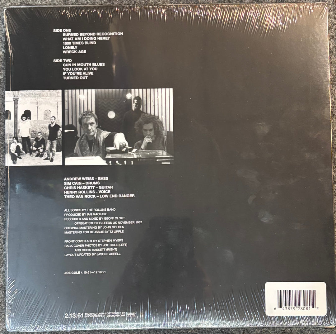 Back cover of ROLLINS BAND – LIFE TIME with text and images of a band.