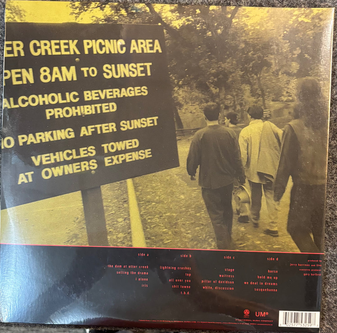 LIVE - Throwing Copper cover with text about a picnic area and people walking in a park.