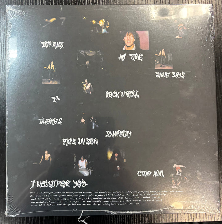 Back cover of a JANE'S ADDICTION record with text and images on a black background
