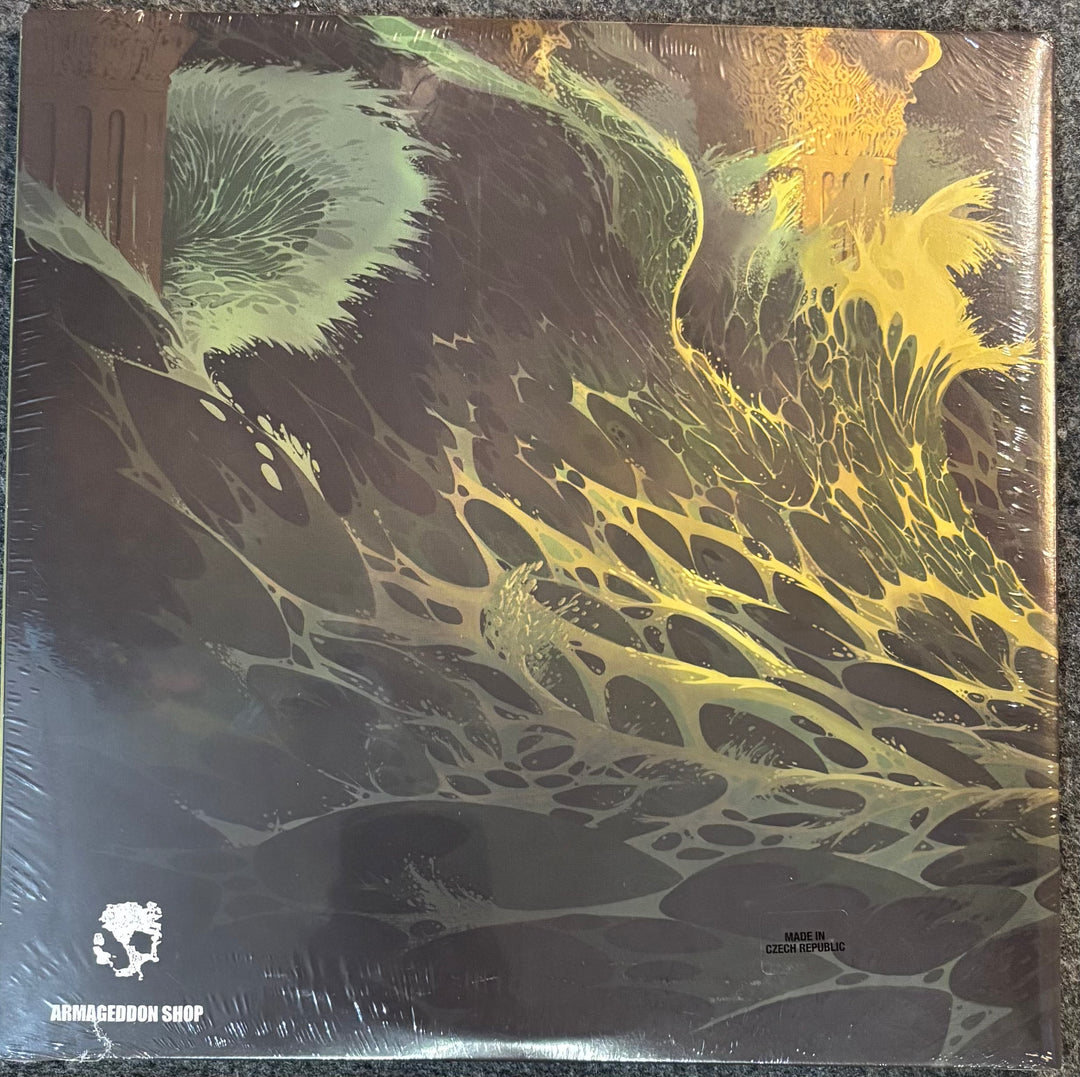 Elder - Elder (+ Demos) record with abstract green and yellow design on a reflective surface, featuring 'Armageddon Shop' logo.