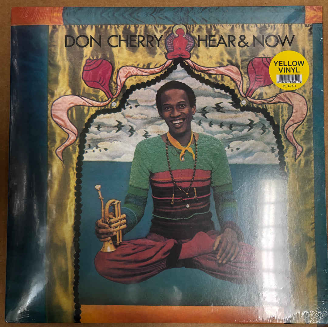Vinyl record cover with a person holding a trumpet, featuring text and a yellow label.