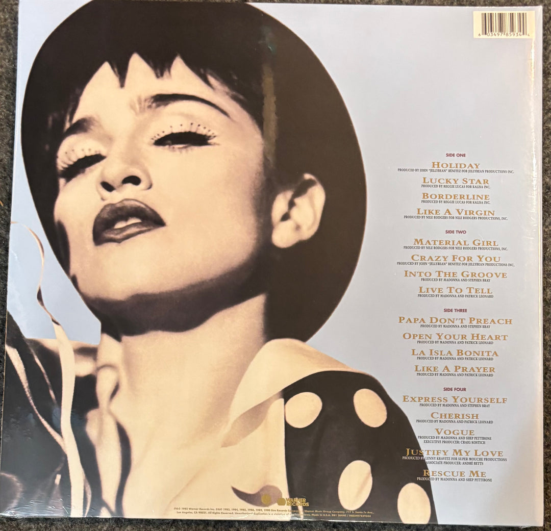 Vinyl record album cover forMadonna - The Immaculate Collection, showing a close-up portrait of Madonna with her eyes closed and tracklist printed on the right side.