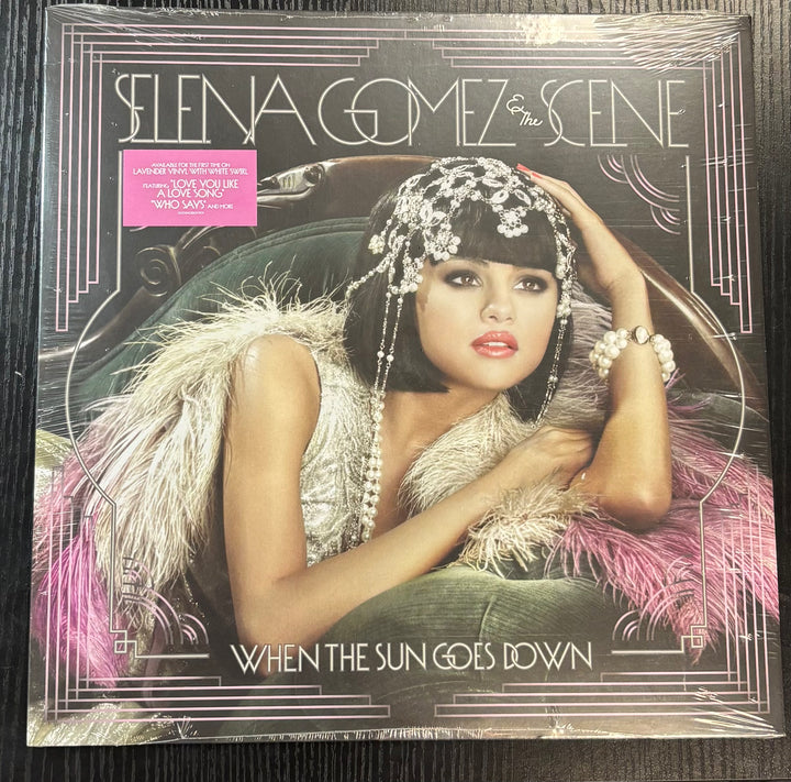 GOMEZ, SELENA & THE SCENE - WHEN THE SUN GOES DOWN Album cover featuring a person with decorative headgear and jewelry, with text 'Selen Gomez & The Scene' and 'When The Sun Goes Down'.